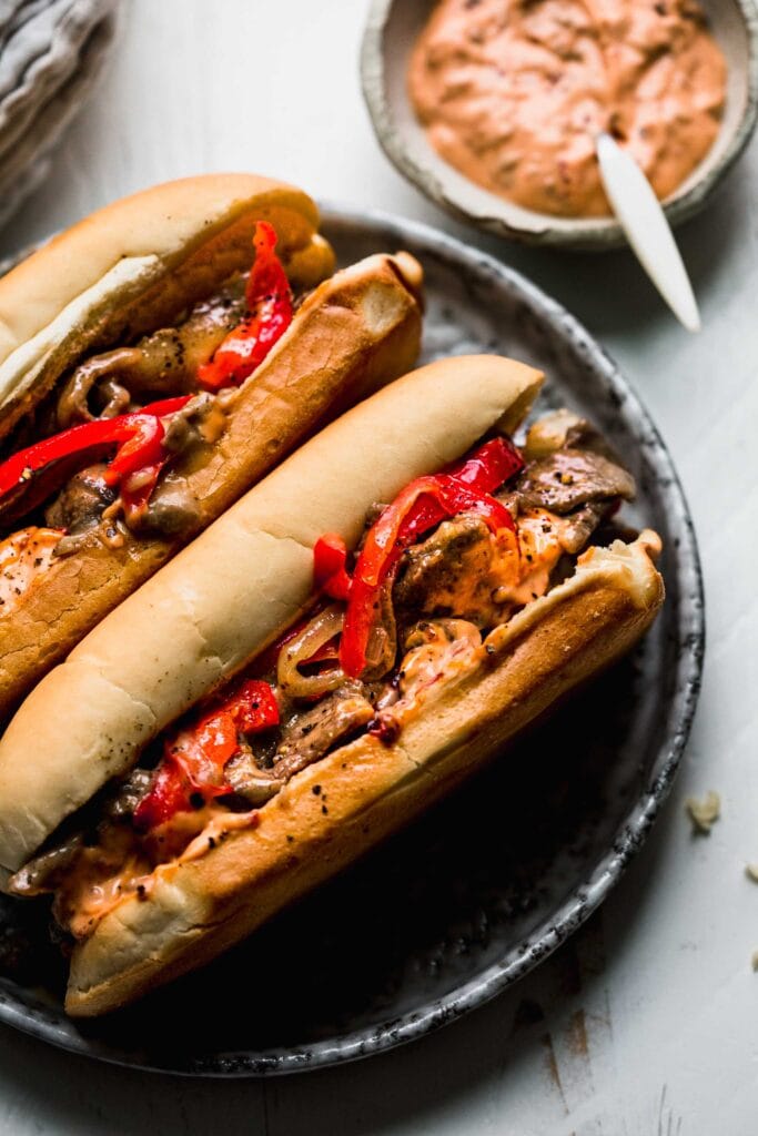 Cheesesteaks on plate. 