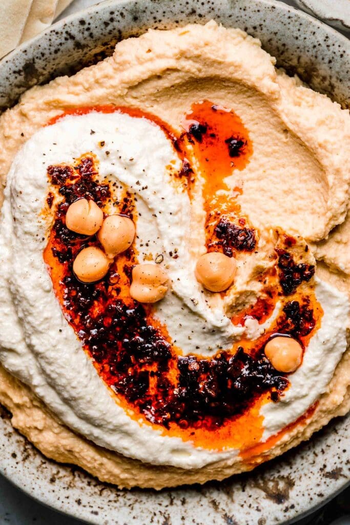 Overhead close up of hummus with chili oil.