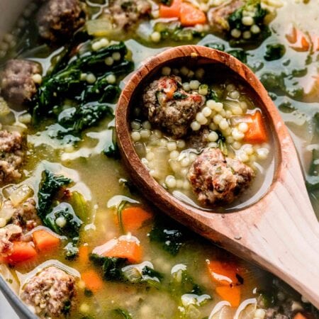 Ladle in pot of wedding soup.