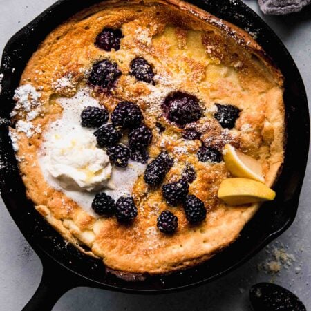 Overhead shot of dutch baby in cast iron skillet.