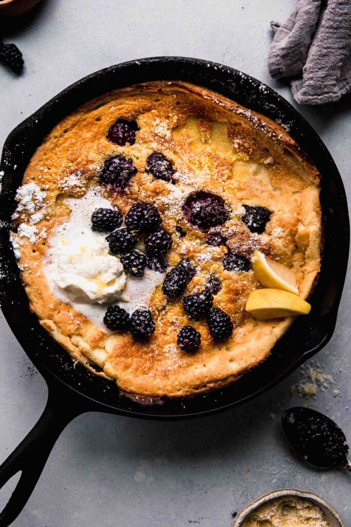 Overhead shot of dutch baby in cast iron skillet.