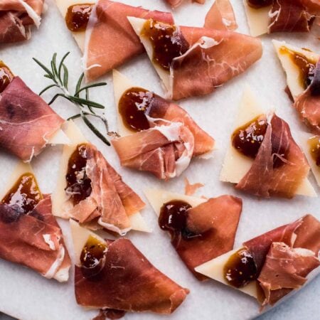 Grana padano wrapped in prosciutto and topped with fig jam.