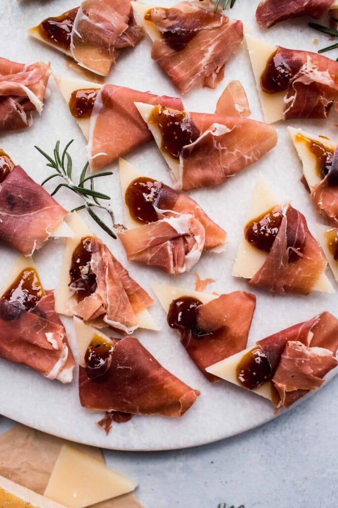 Grana padano wrapped in prosciutto and topped with fig jam.