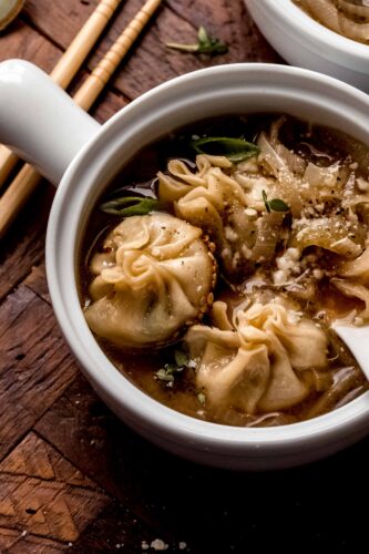 French onion soup dumplings in bowl.