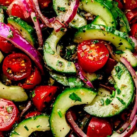 Overhead close up of tomato cucumber salad.