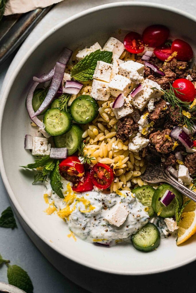 Overhead close up of lemon orzo with ground lamb. 