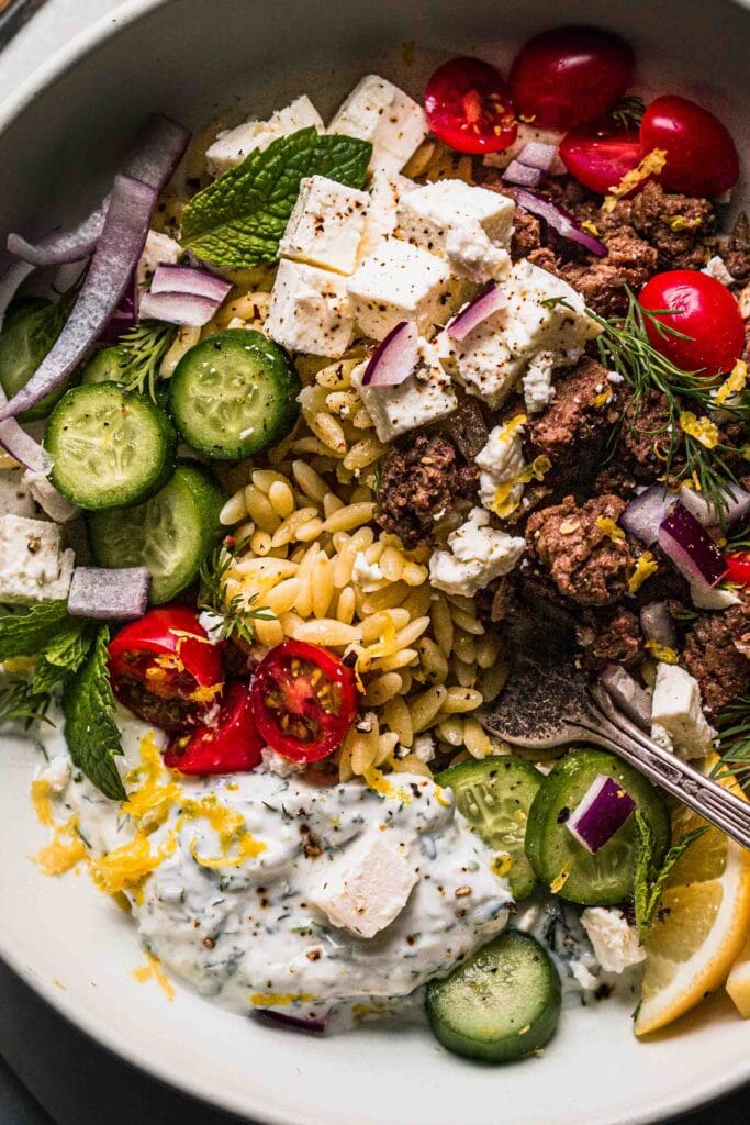 Extreme close up of lamb bowl with toppings. 