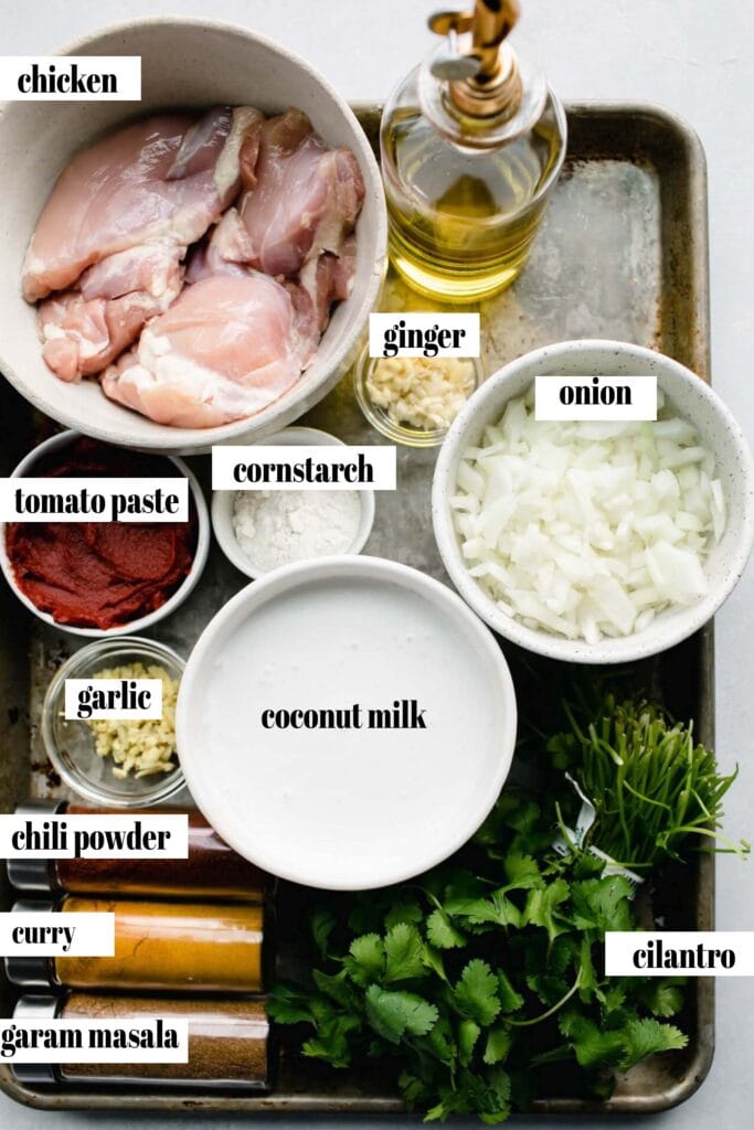 Ingredients for instant pot butter chicken labeled on counter. 