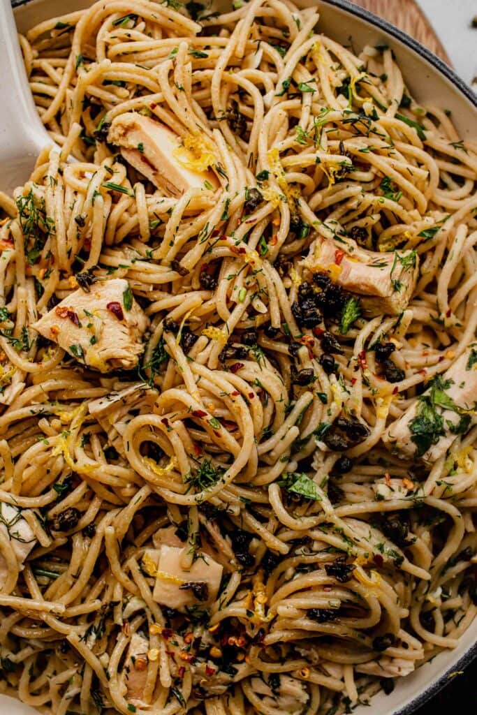 Overhead extreme close up of tuna pasta in skillet.