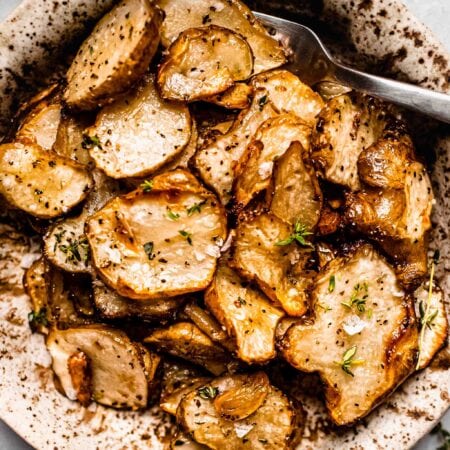 Overhead shot of cooked sunchokes in bowl.