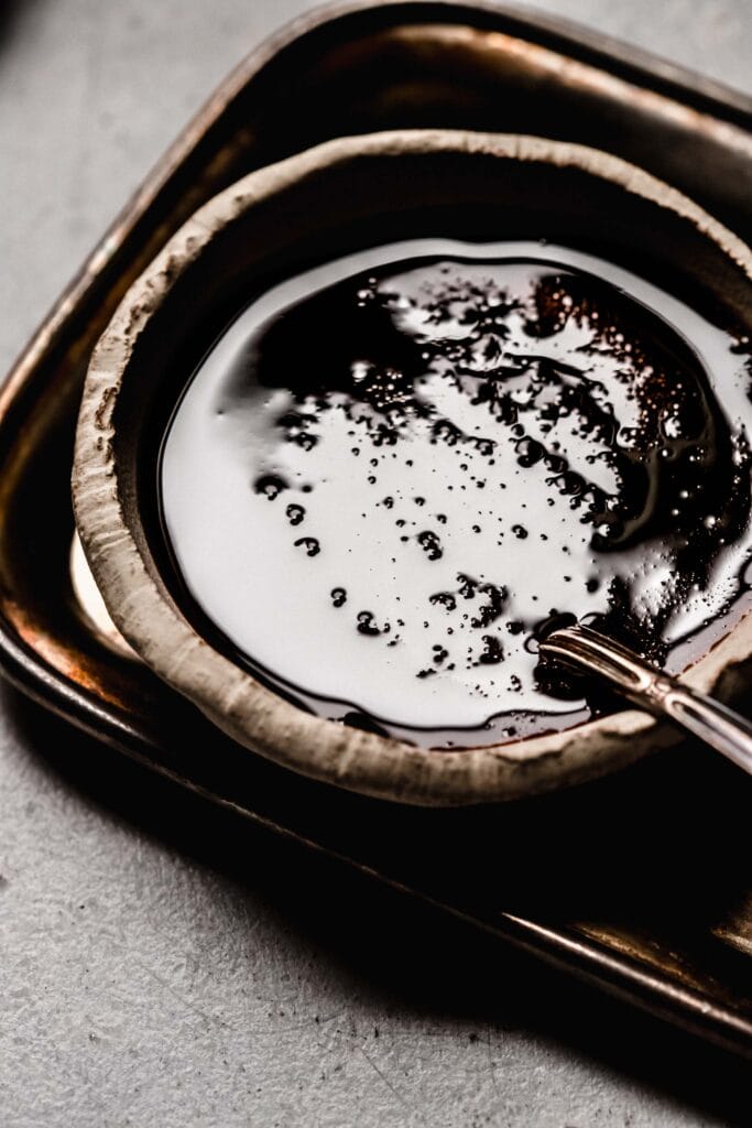 Bowl of kecap manis with spoon. 