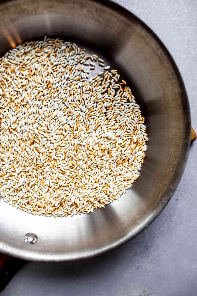 Toasted rice in skillet. 