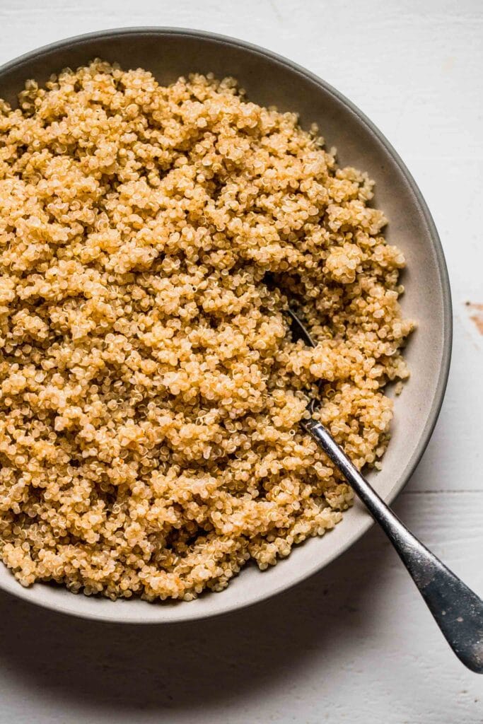 Cooked quinoa grains in serving bowl. 