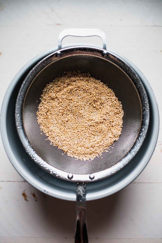Rinsed quinoa in strainer. 