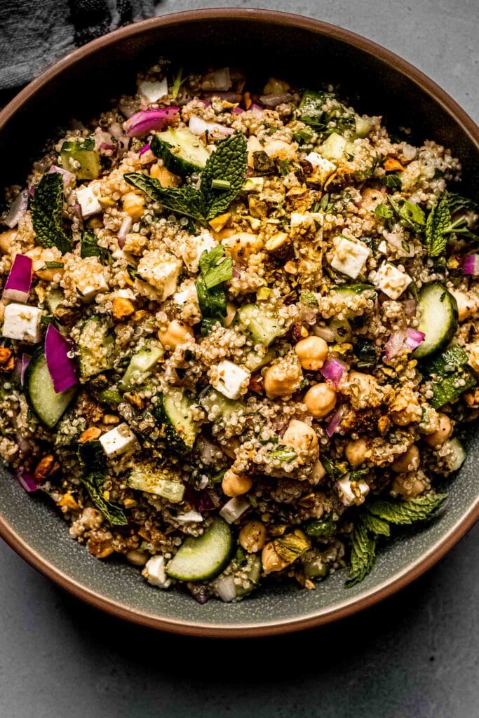 Overhead shot of prepared Jennifer Aniston Salad in green bowl.