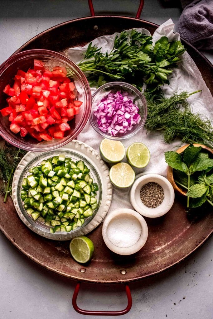 Ingredients for shirazi salad on tray. 