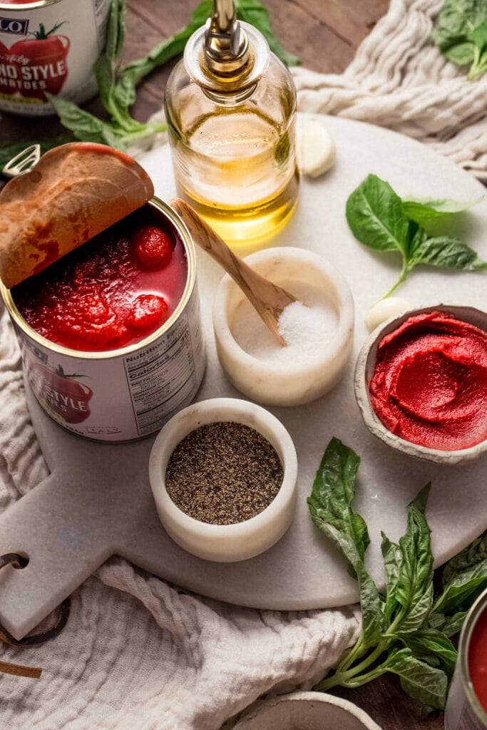 Ingredients for Sunday gravy on counter.