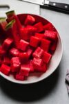 Watermelon cubes in bowl.