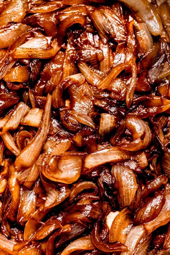 Extreme close up of caramelized sauteed onions. 