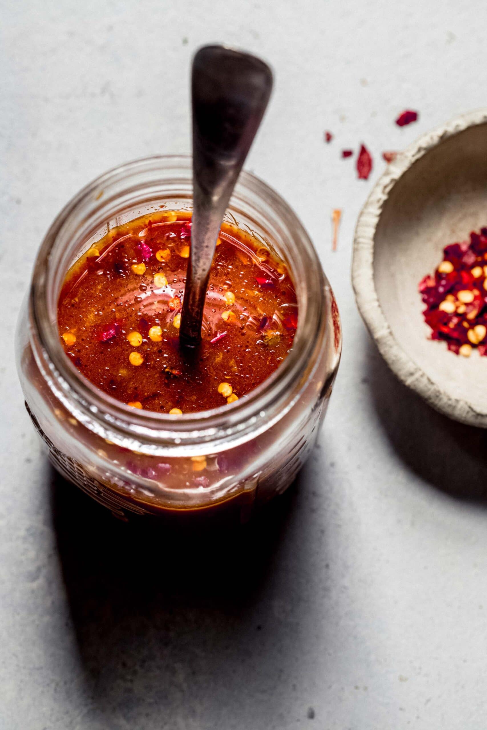 Overhead shot of stir fry sauce in small glass jar.