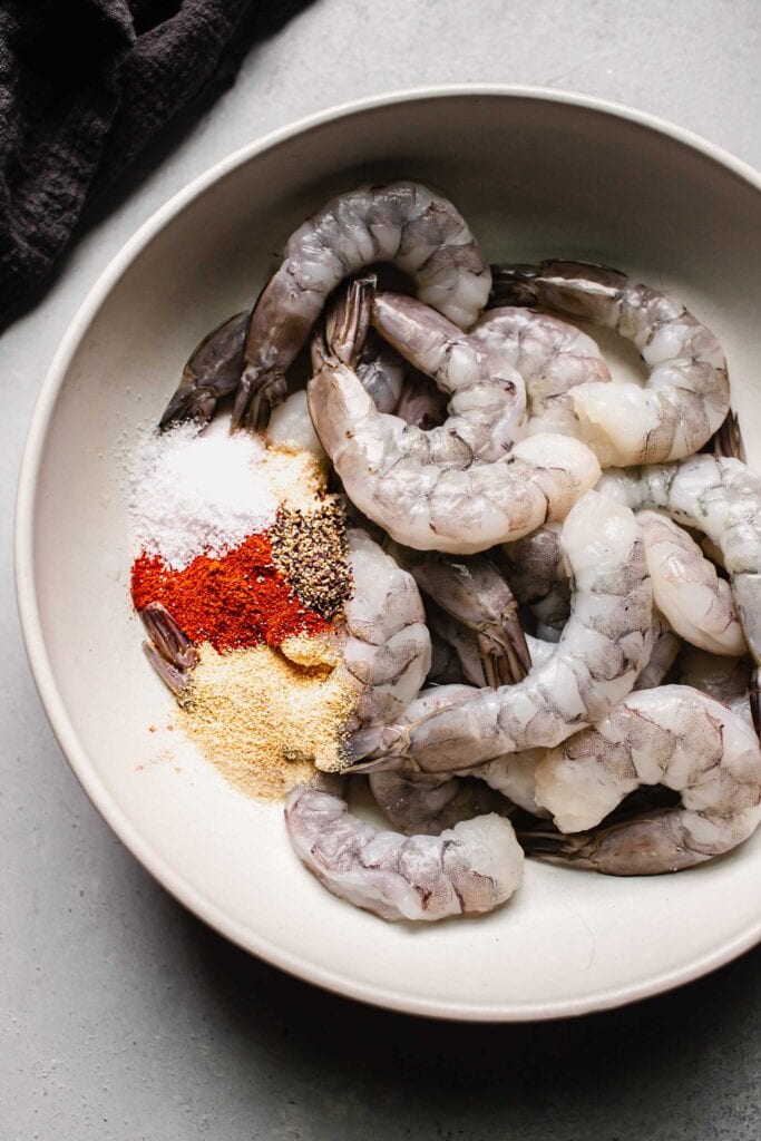 Shrimp in bowl with spices. 