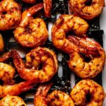 Shrimp in air fryer basket.