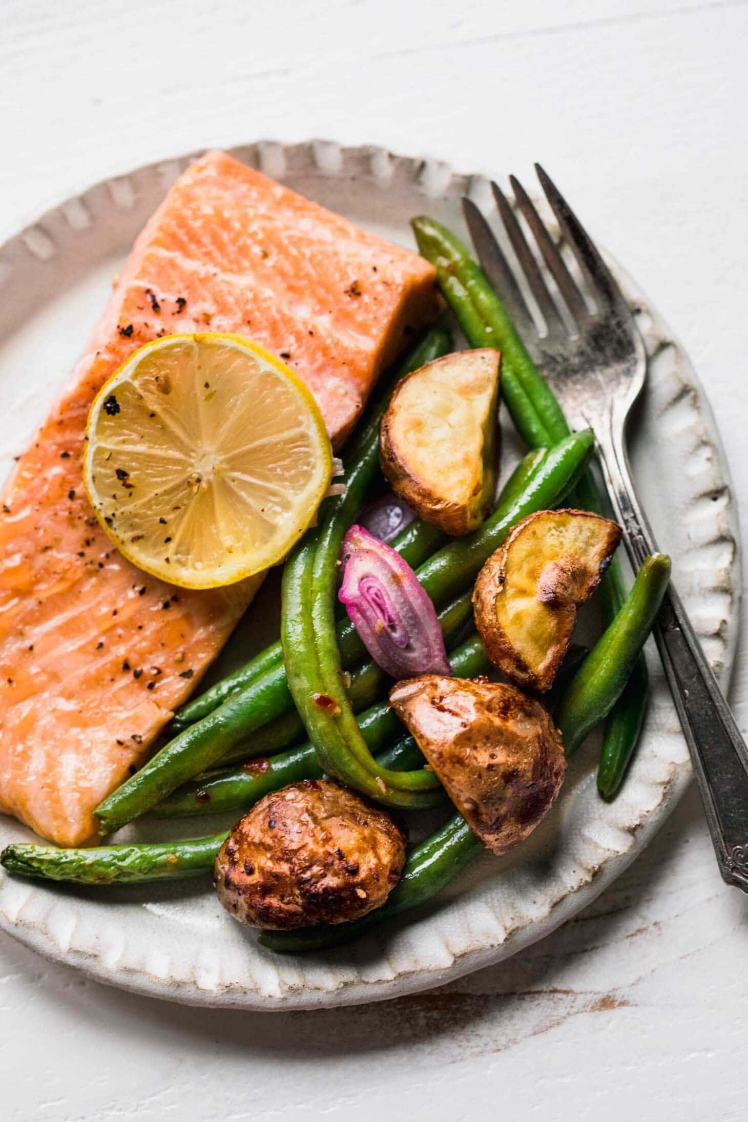 Filet of baked salmon on plate.