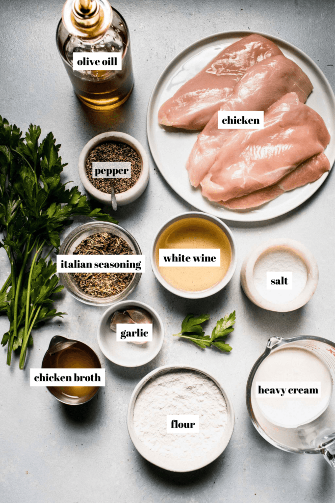 Ingredients for chicken in white wine sauce labeled on counter.