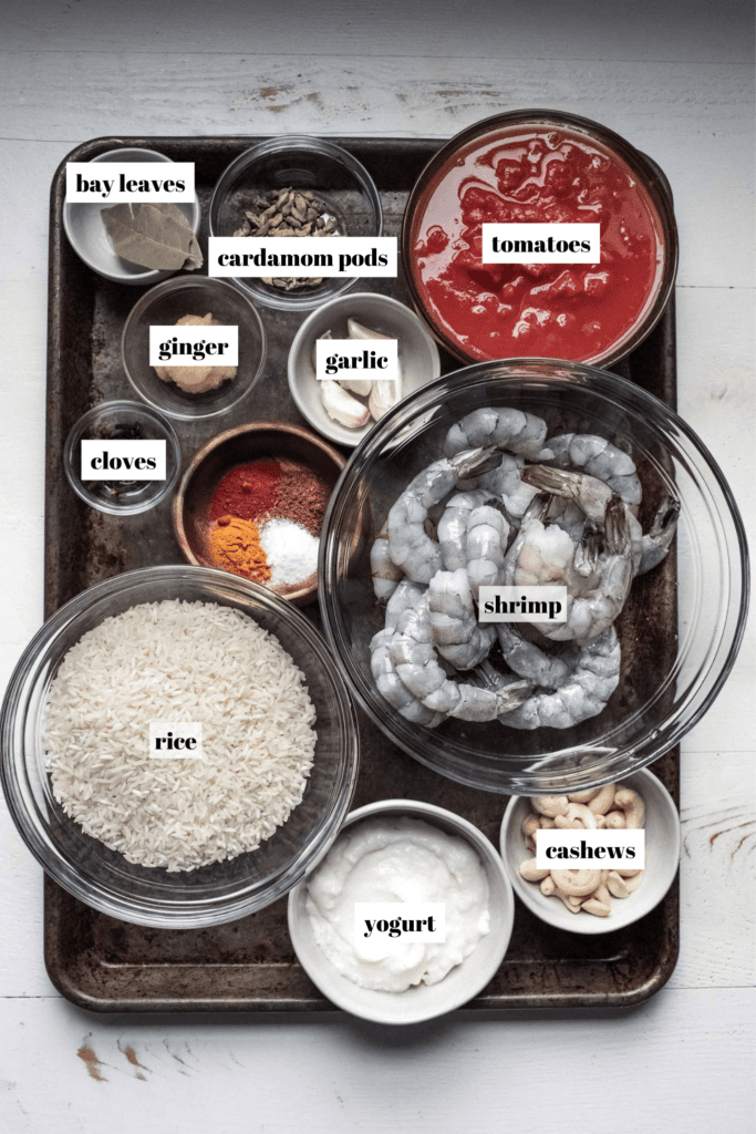 Ingredients for biryani laid out on tray and labeled. 