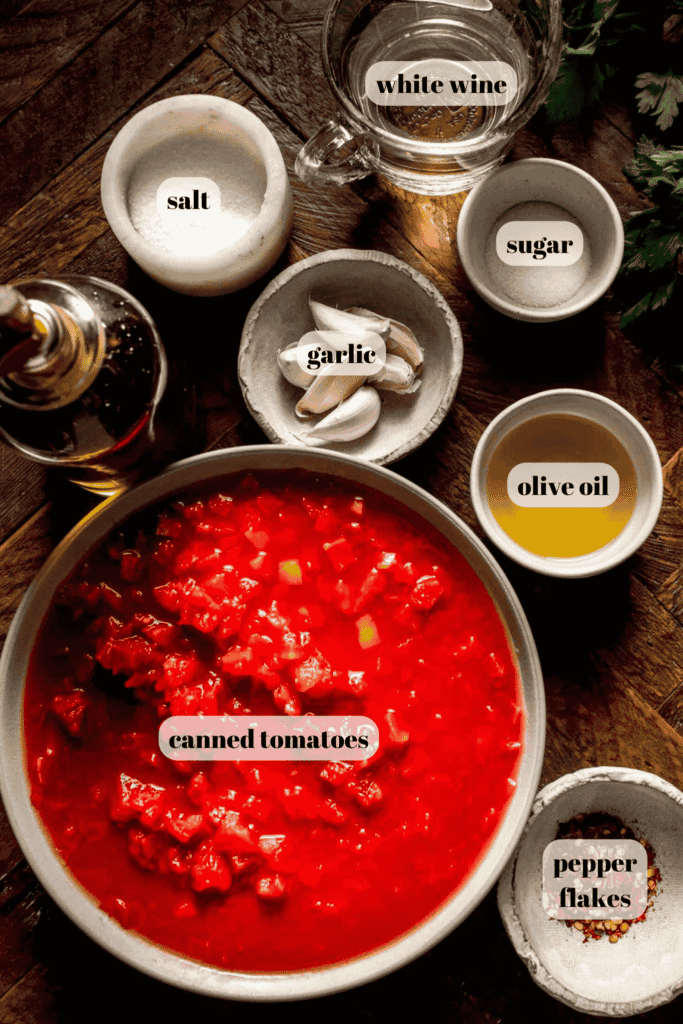 Ingredients for spicy fra diavolo sauce labeled on counter. 