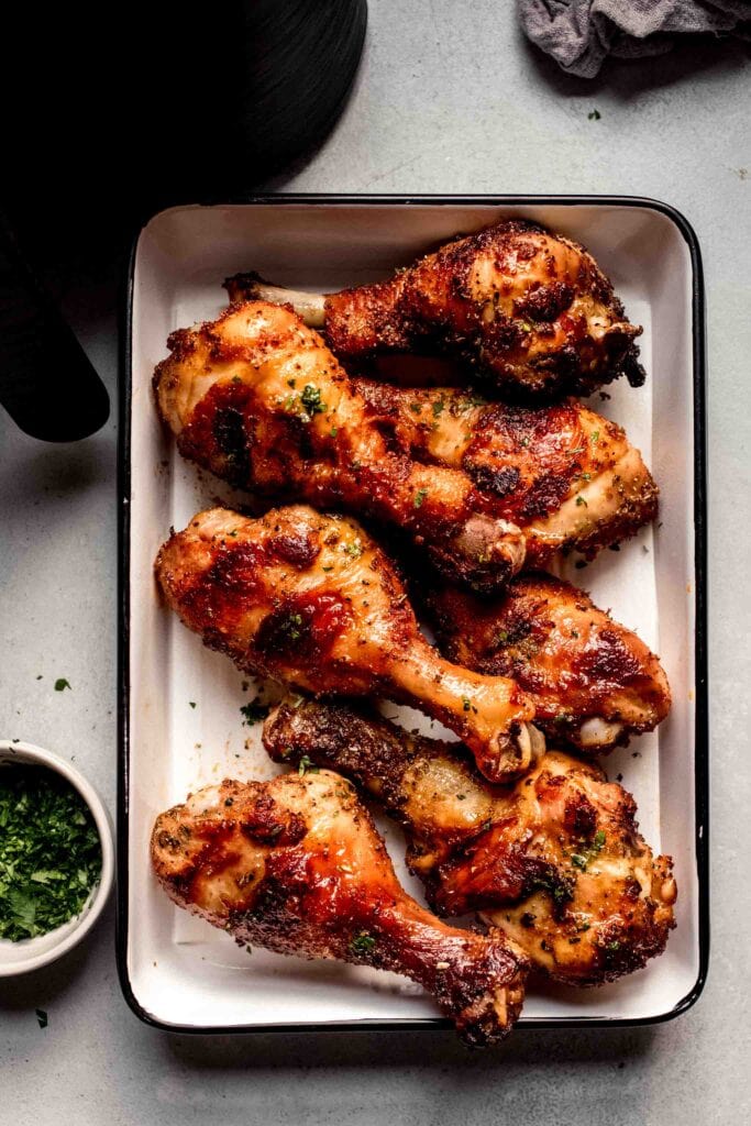 Air fried drumsticks on serving tray. 