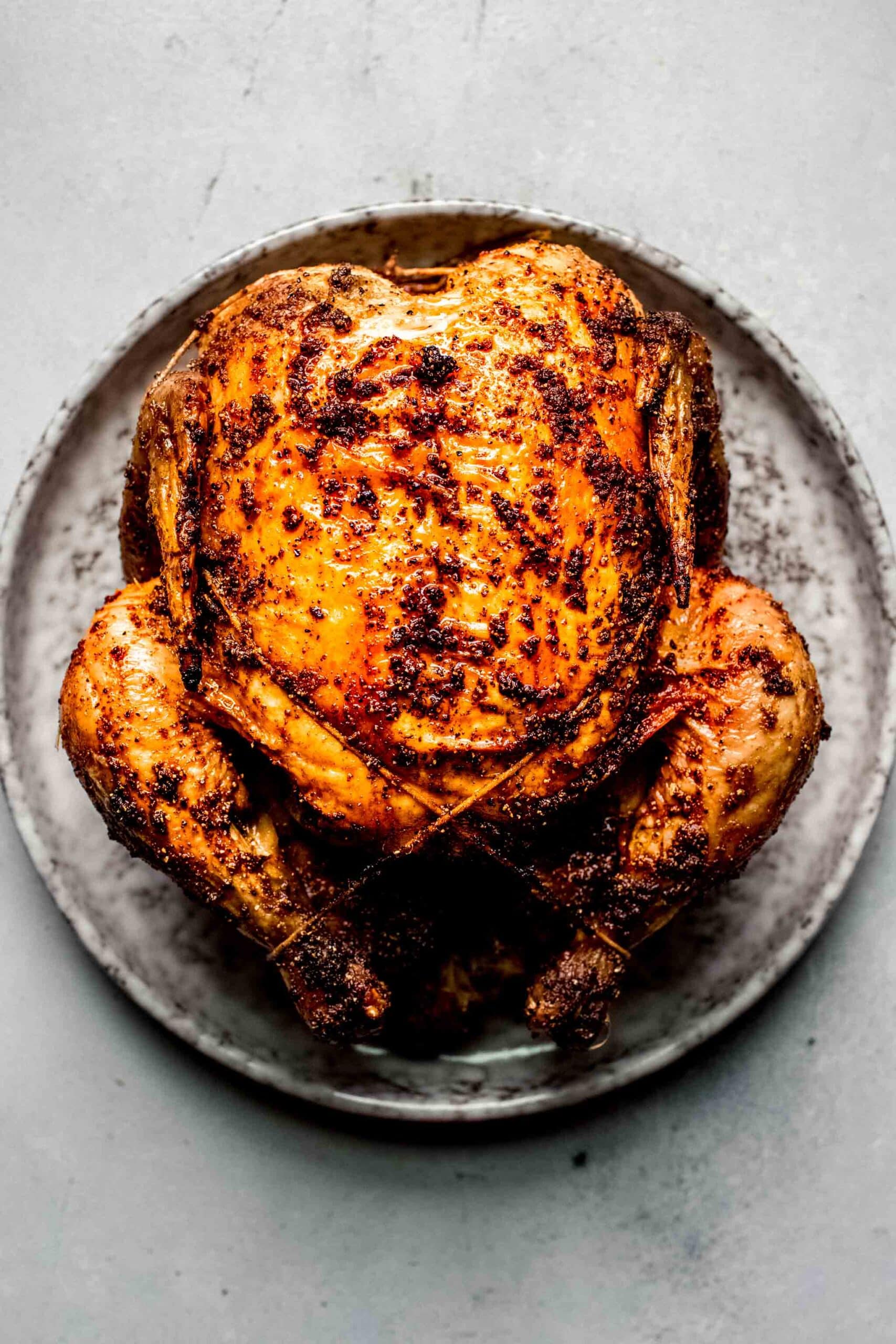 Crispy roast chicken on plate.