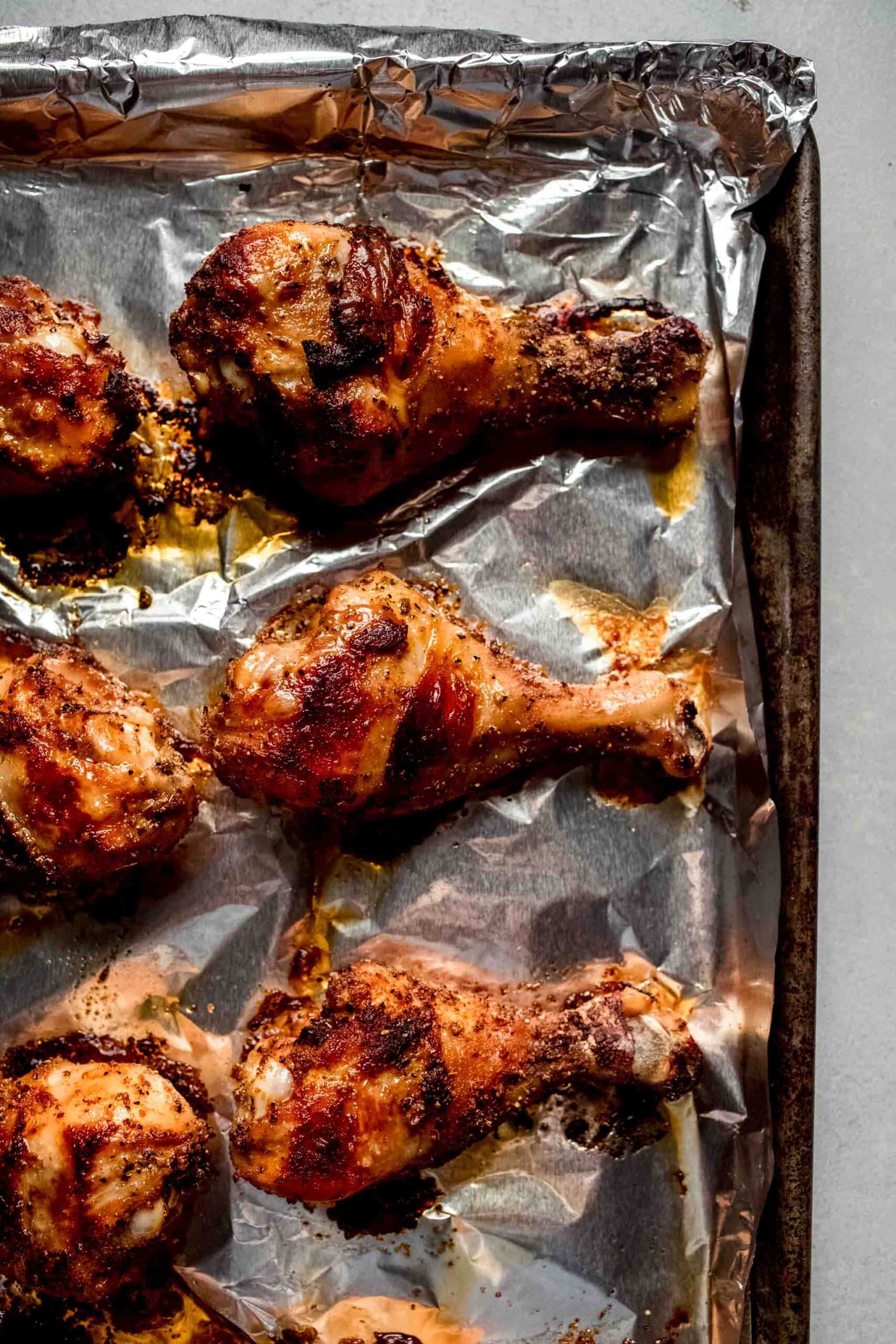 Baked chicken legs on sheet pan. 