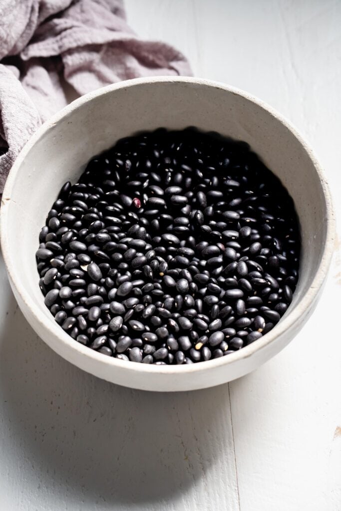 Dried black beans in bowl. 