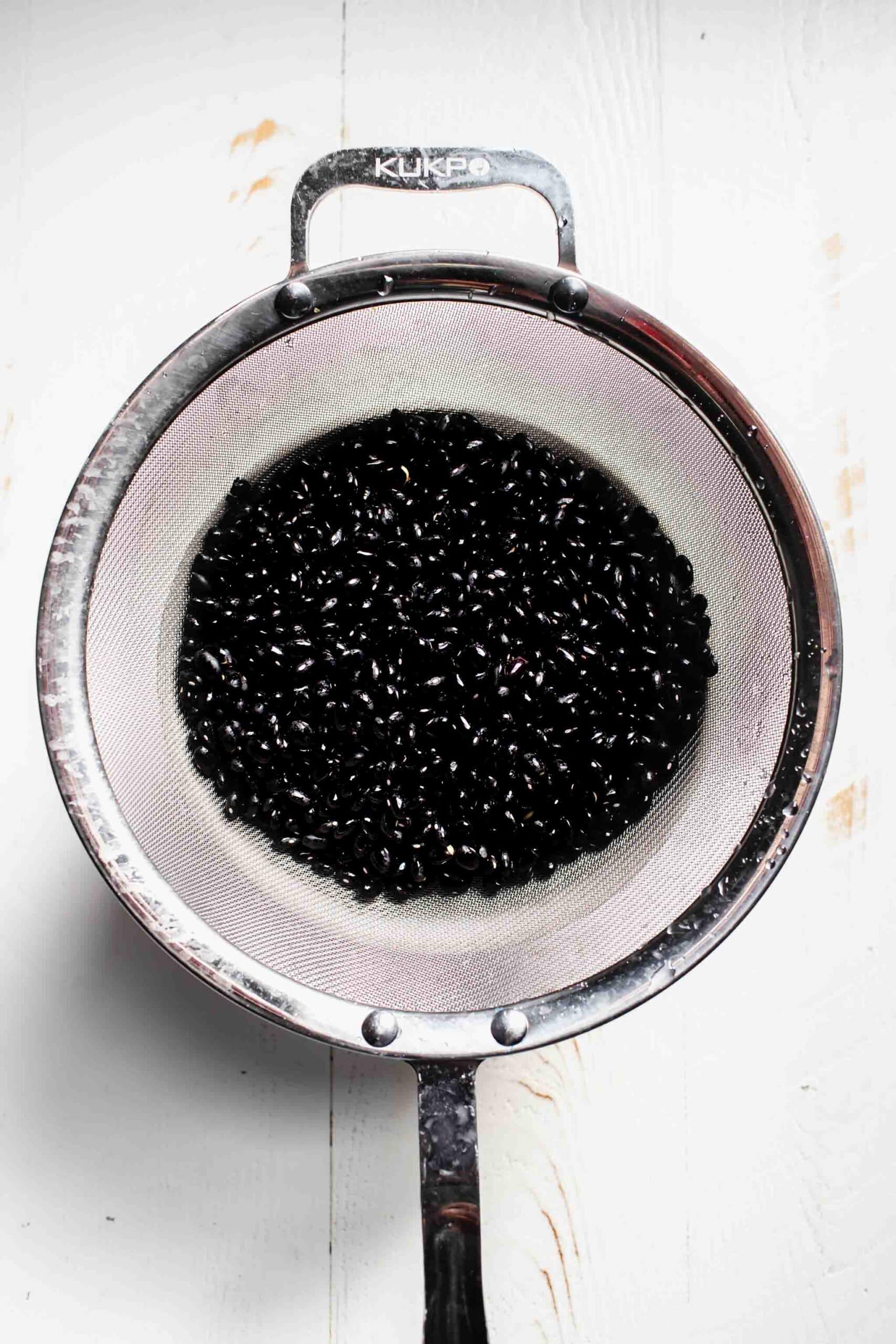 Black beans in strainer. 