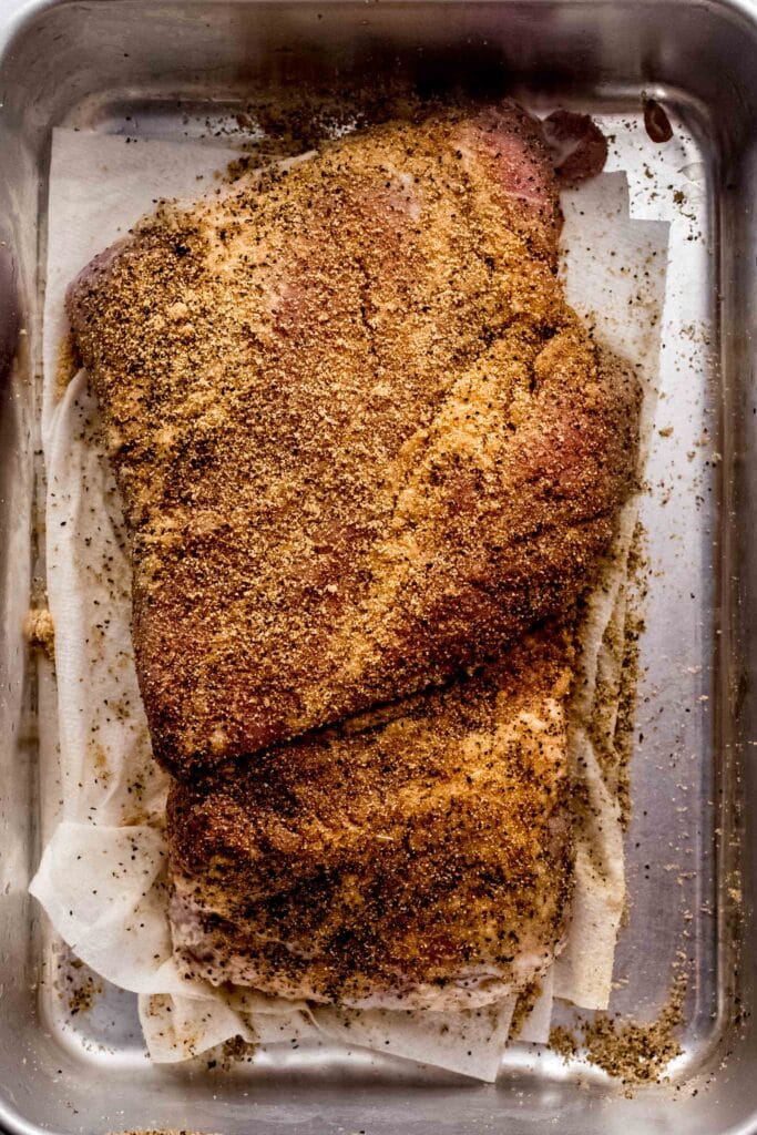 Uncooked corned beef rubbed with spices. 
