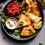 Canned chicken quesadillas arranged on plate.