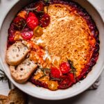 Crostini dipped into melty goat cheese.