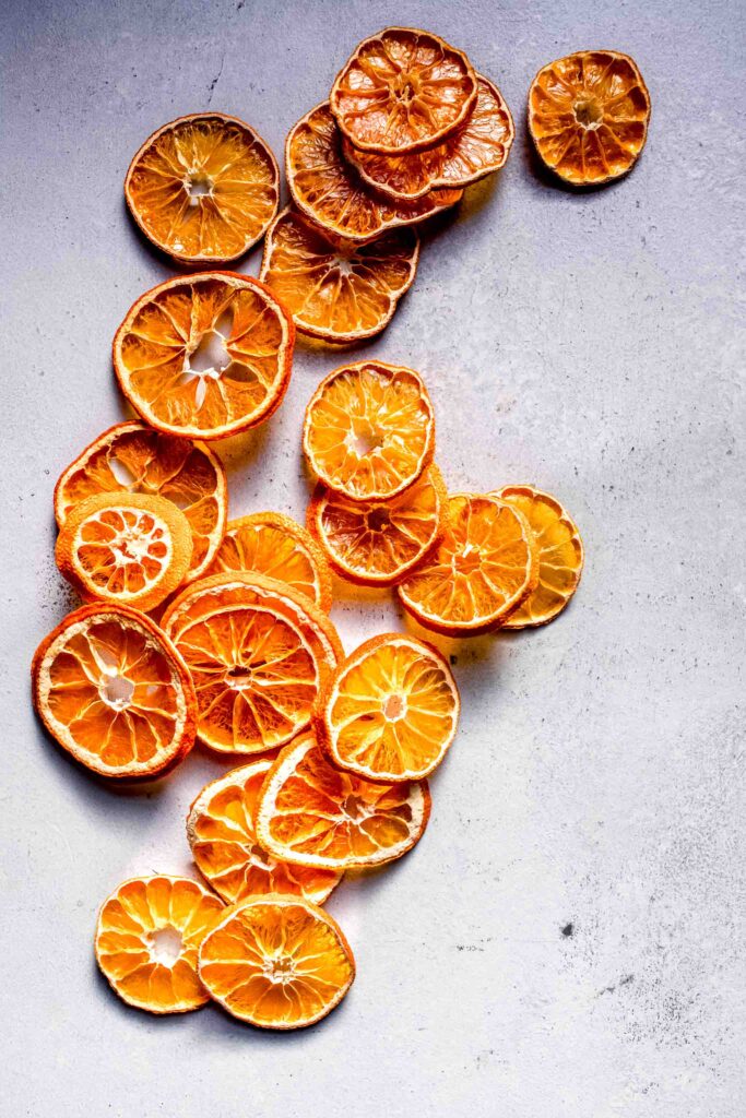 Dried orange slices scattered on counter. 