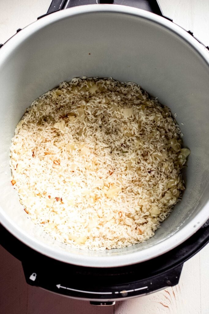 Rice being toasted in instant pot. 