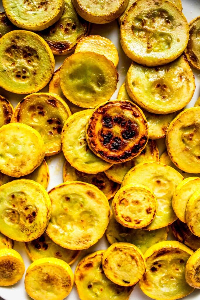 Browned yellow squash in skillet.