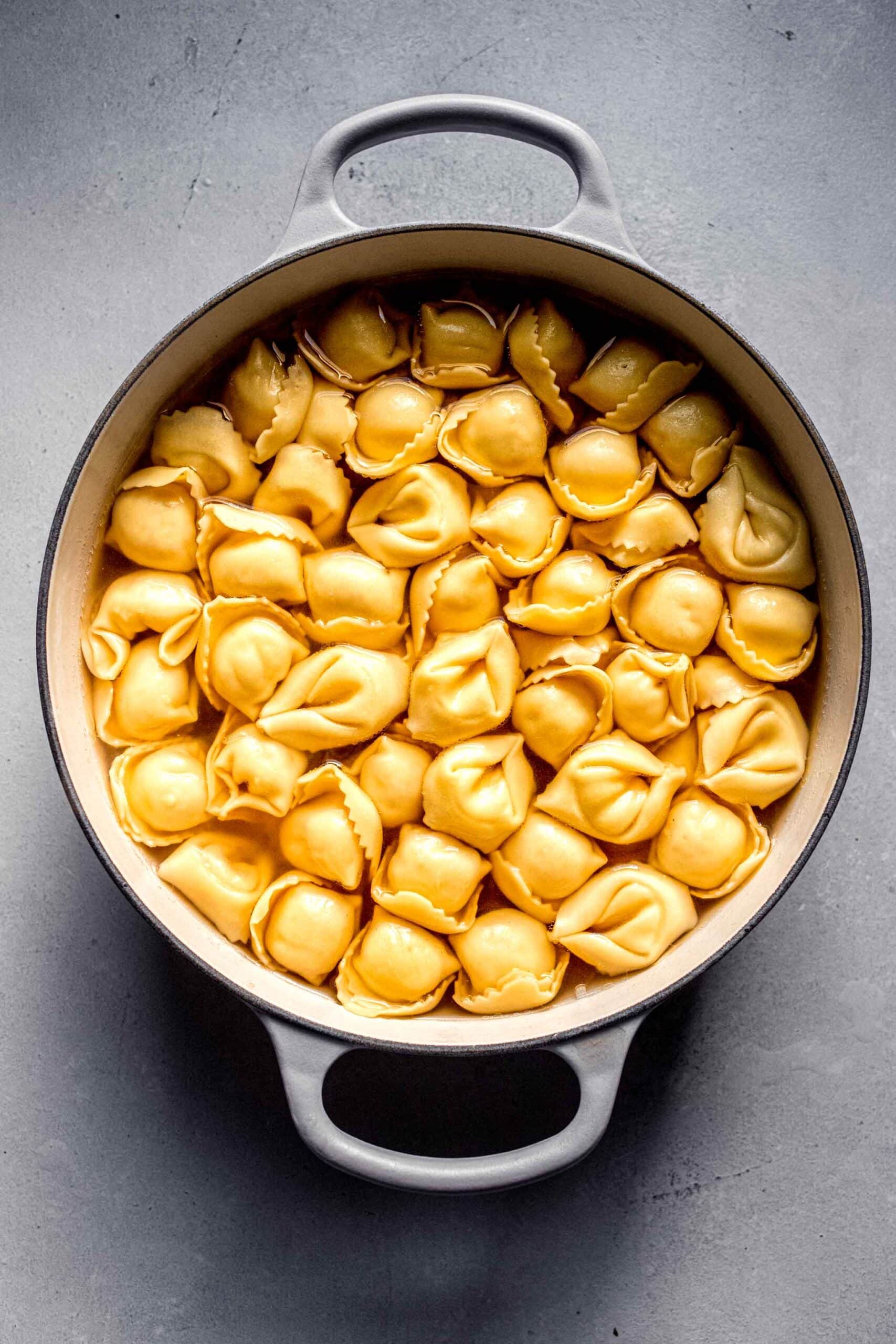 Tortellini simmered in broth. 