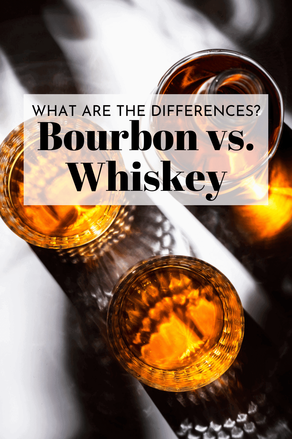 Glasses of dark liquor with text overlay - bourbon vs. whiskey.