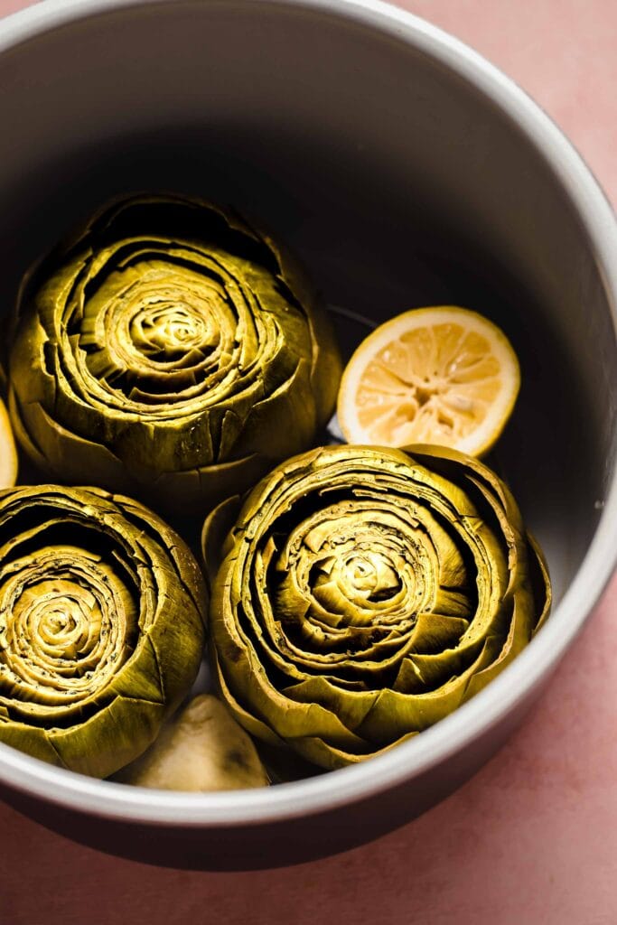 Artichokes in instant pot liner.