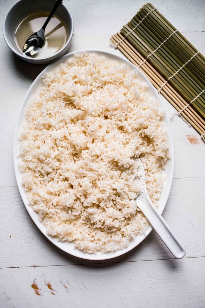 Rice cooling on large plate.
