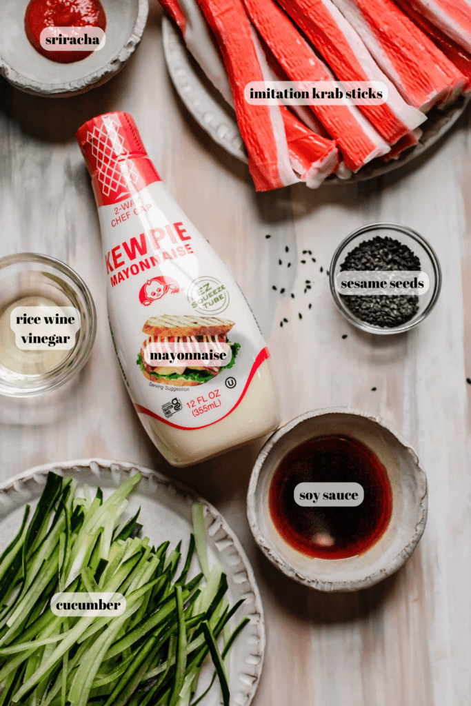 Ingredients for kani salad labeled on counter. 