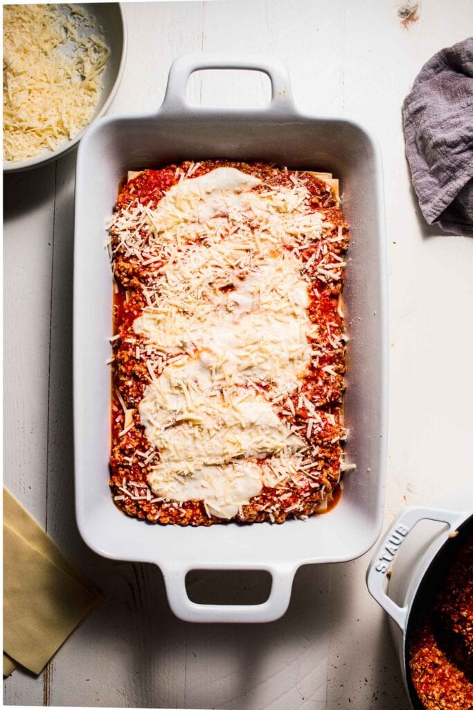 Lasagna sprinkled with parmesan. 