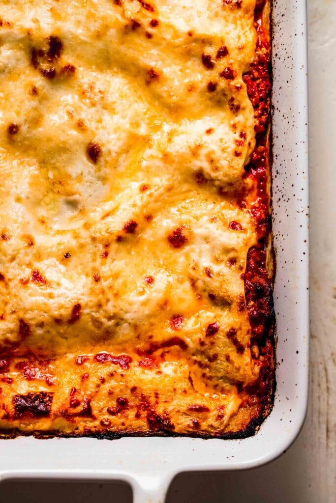 Overhead shot of cooked lasagna in pan before serving. 