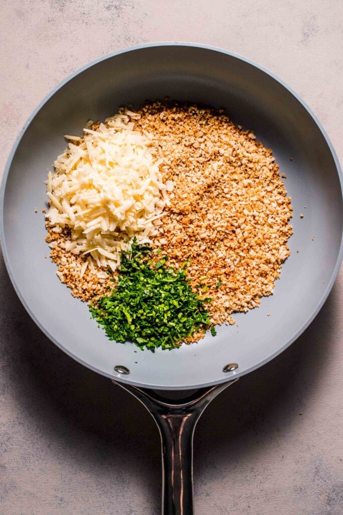 Toasted panko with parmesan and parsley in skillet. 