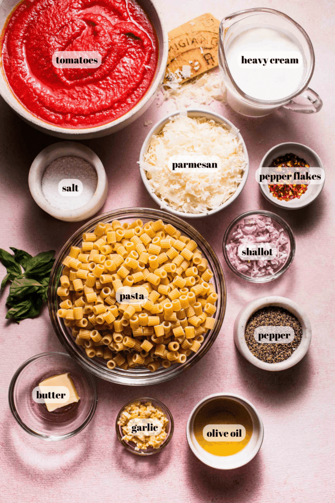 Ingredients for rose sauce pasta labeled on counter. 